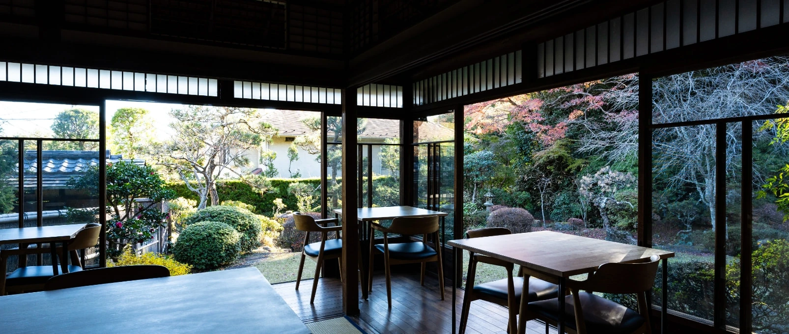 Tables beside the windows overlooking Sasho’s Japanese garden